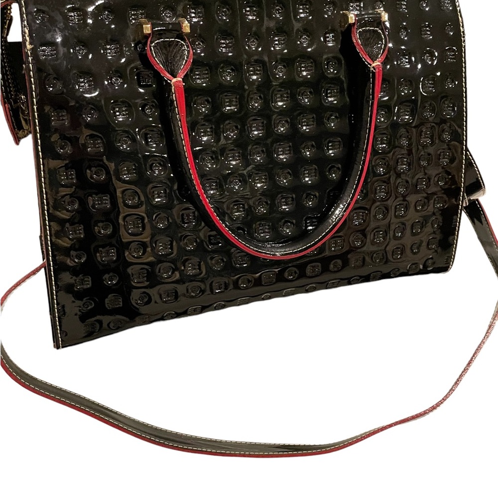 Black, embossed  patent leather tote w/ red trim. Beautiful work bag.